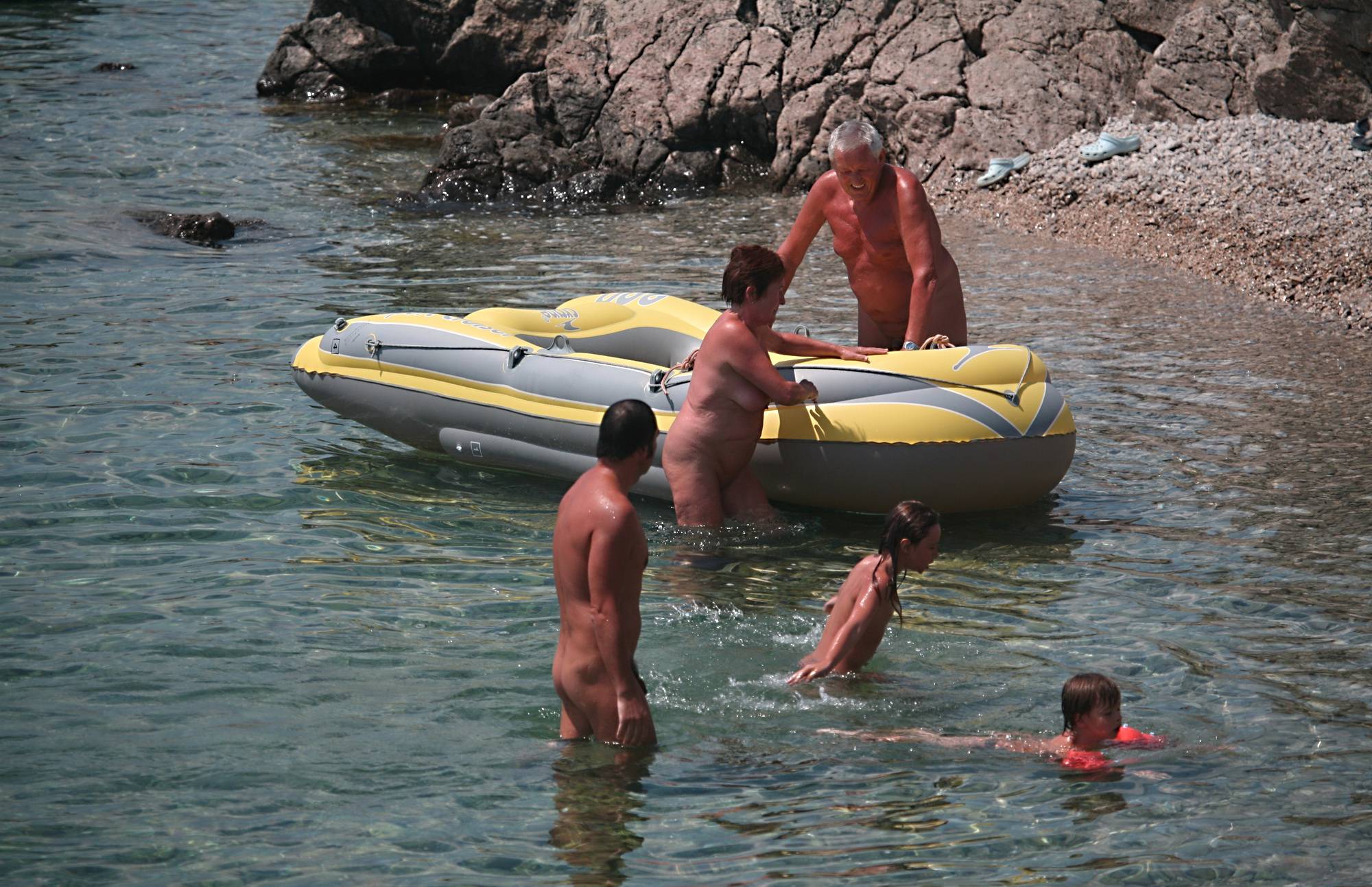 Pure Nudism Pics-Lone Nudist in Yellow Boat - 1