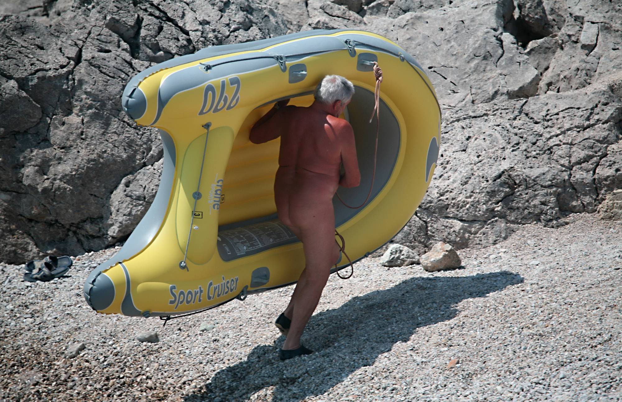 Lone Nudist in Yellow Boat - 2